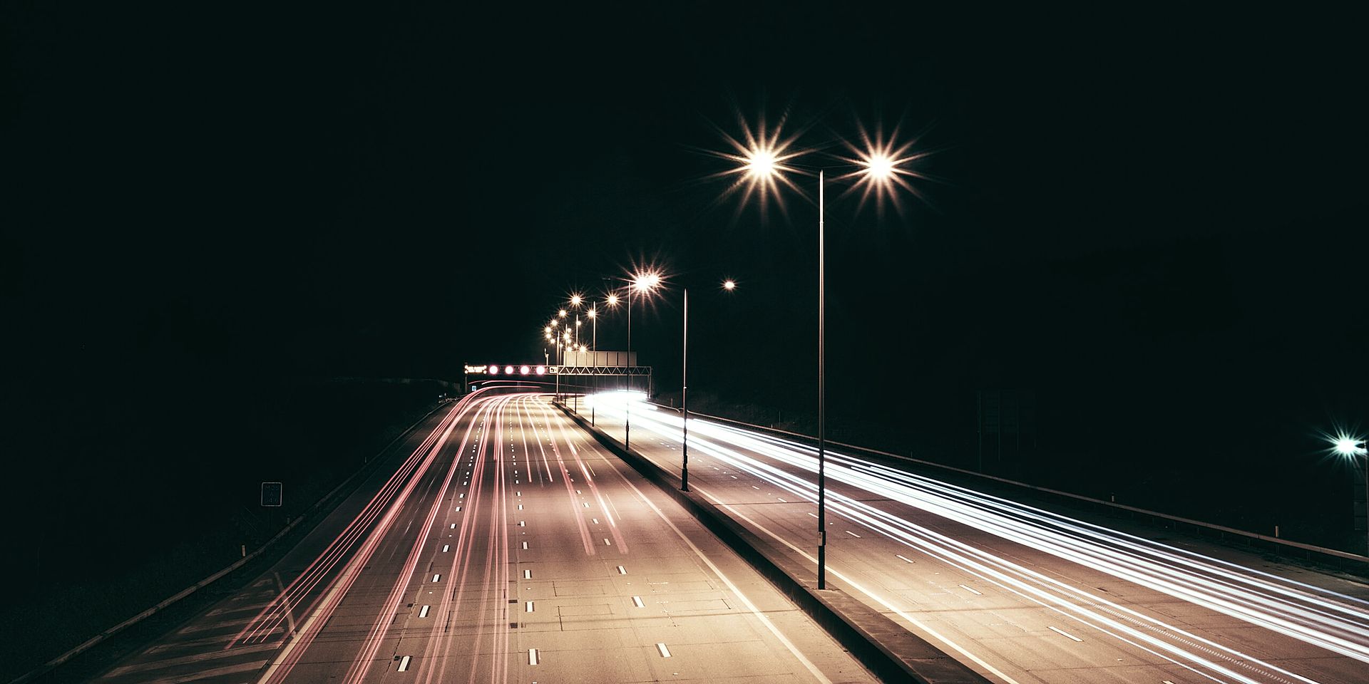 Night motorway, long-exposure freight traffic